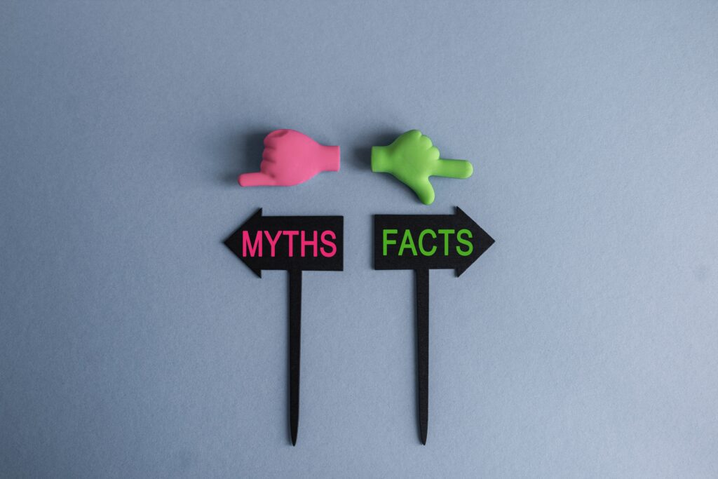 social security myths and facts flags with green and pink hands