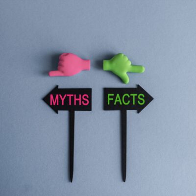 social security myths and facts flags with green and pink hands